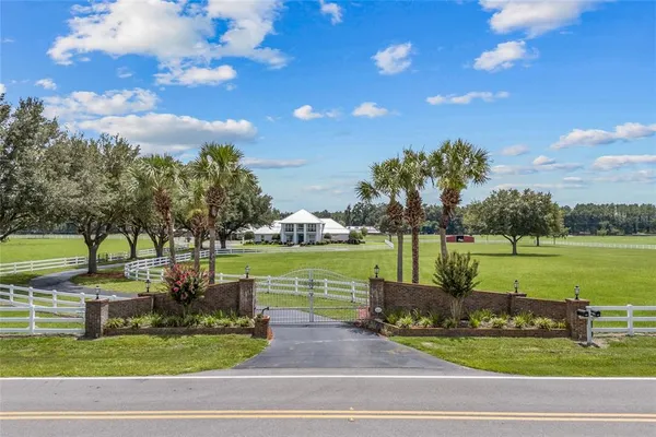 an aerial view of a house with outdoor space patio and mountain view