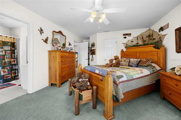 a living room with furniture kitchen view and a fireplace