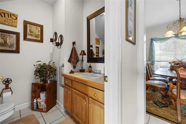 a living room with furniture fireplace and a large window