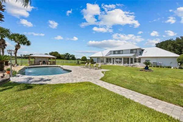 a view of a a dining room with furniture window and outside view