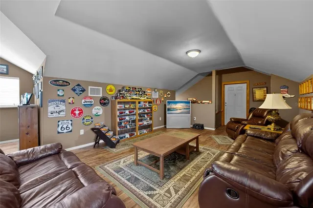 an aerial view of a house with a yard basket ball court and outdoor seating