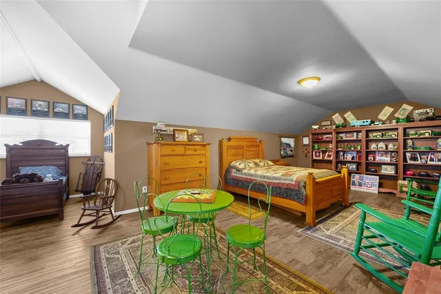 an aerial view of a house with outdoor space lake view and ocean view