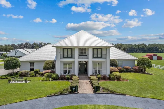 a view of a dining room and hall with furniture