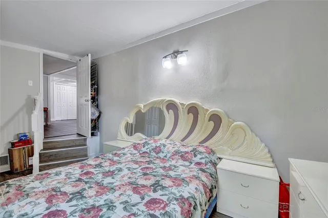 a bedroom with a bed and a dresser