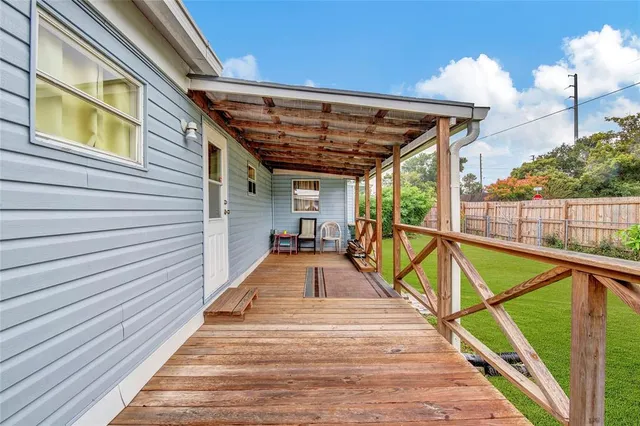 a view of a swimming pool with a porch