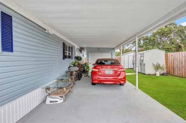 a backyard of a house with outdoor seating