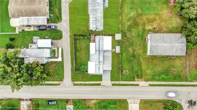 an aerial view of residential houses with outdoor space
