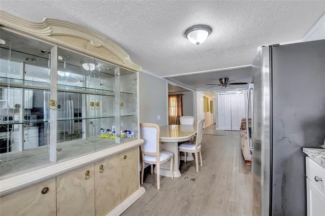 a bathroom with a sink mirror and a toilet