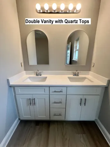 a view of a livingroom with a ceiling fan and window