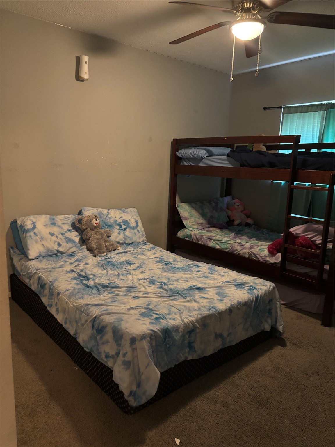 22223 Spring Gate Drive Spring, TX 77373 - Photo 14 of 15 a bedroom with a bed and a chandelier