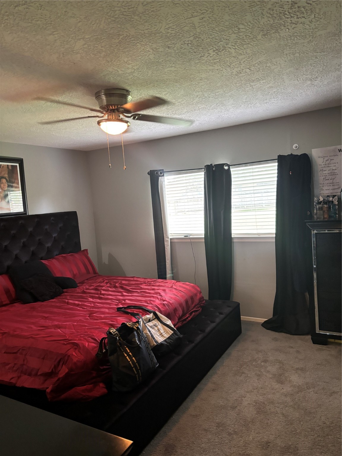 22223 Spring Gate Drive Spring, TX 77373 - Photo 10 of 15 a bedroom with a bed and dresser with mirror