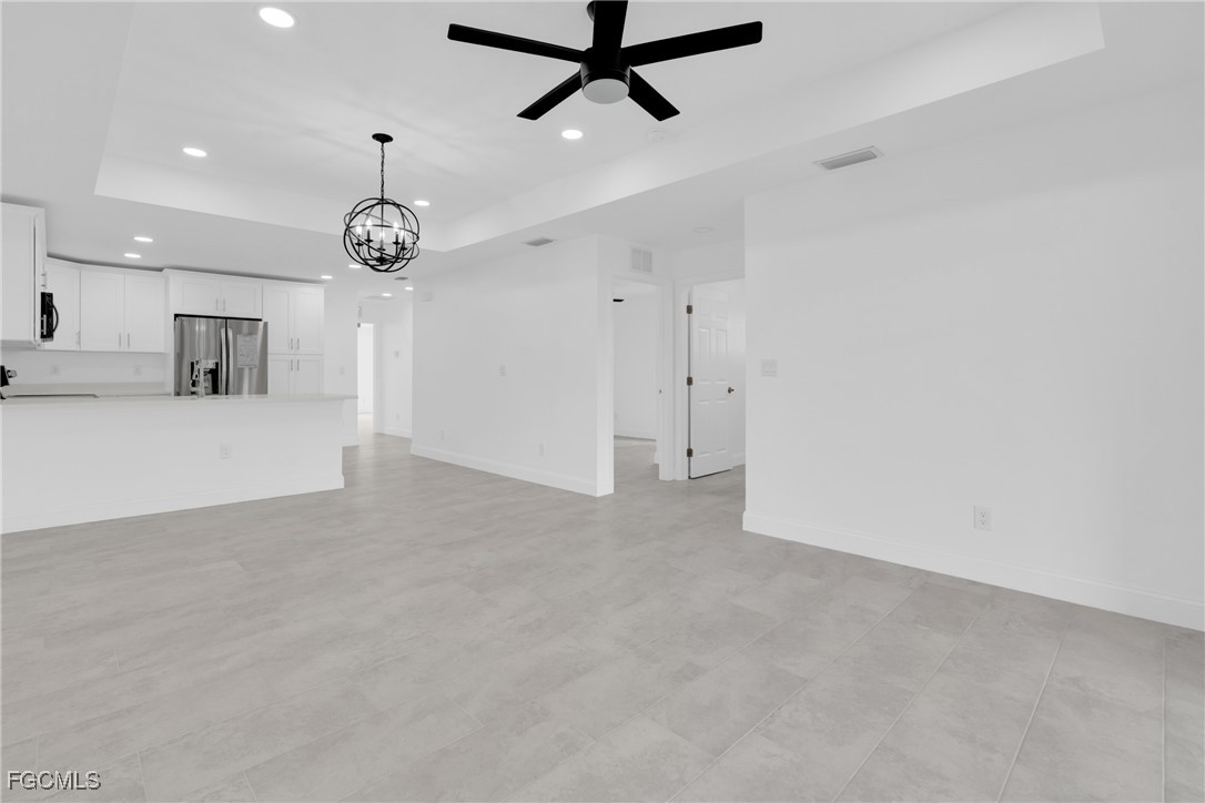 2508-2510 Park Road Lehigh Acres, FL 33971 - Photo 19 of 37 an empty room with a ceiling fan and a ceiling fan