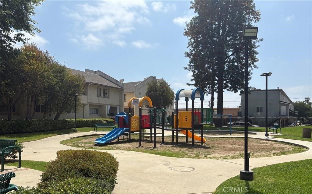 7651 Reseda Boulevard, Unit 12 Reseda, CA 91335 - Photo 4 of 6 a view of a park with swings and slides