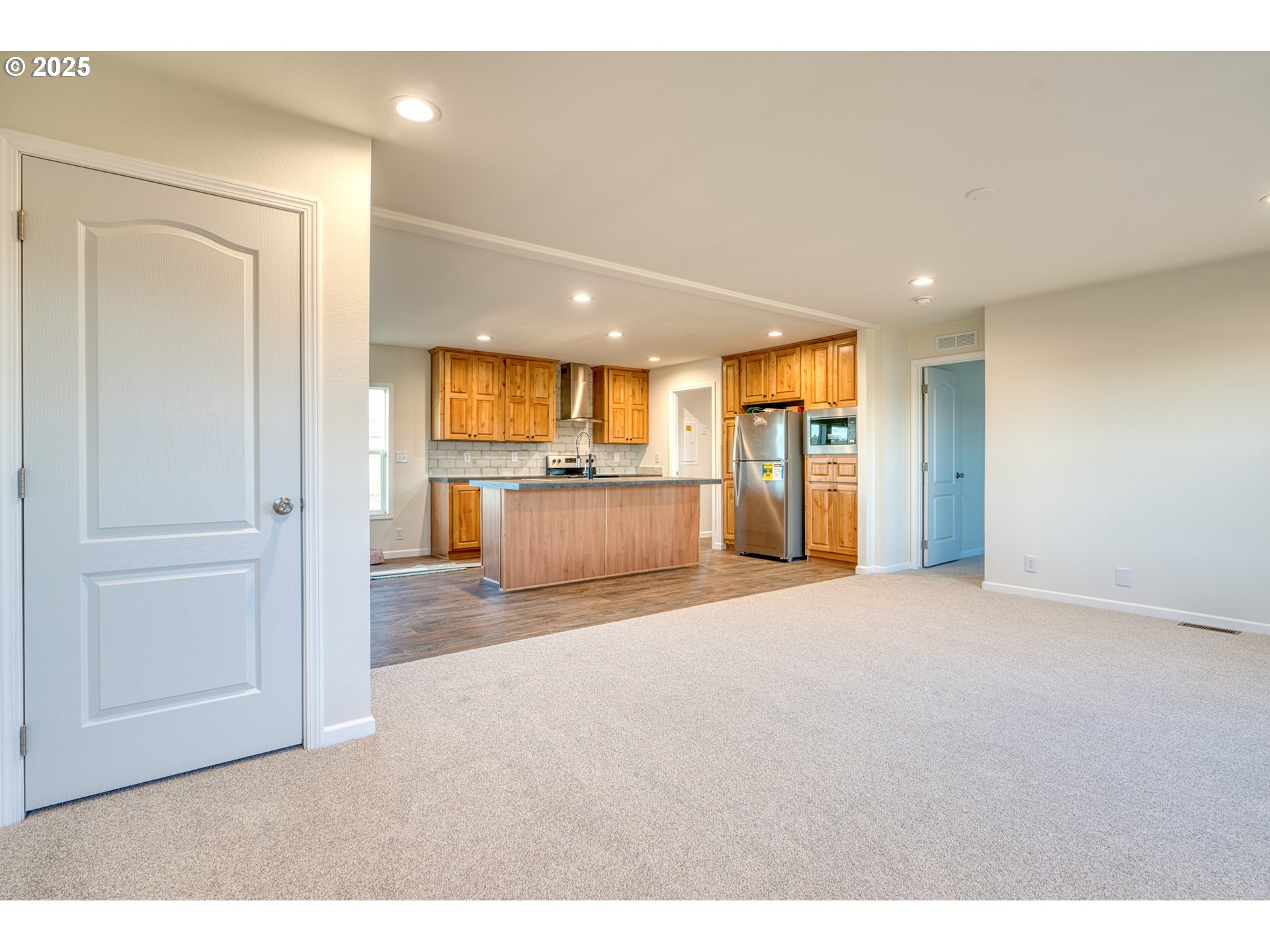 959 High Prairie Road Lyle, WA 98635 - Photo 13 of 34 a open kitchen with a refrigerator and a sink