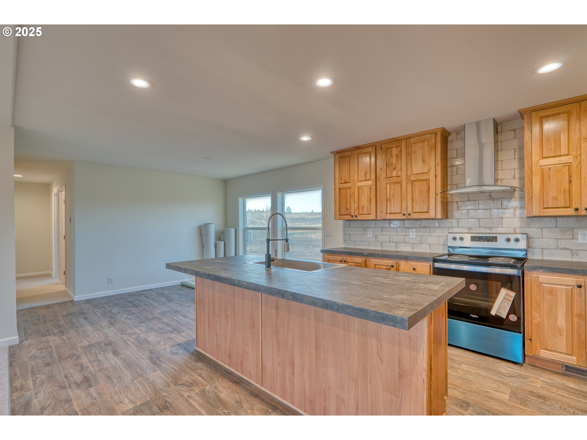 959 High Prairie Road Lyle, WA 98635 - Photo 4 of 34 a kitchen with kitchen island a sink stove and granite counter top