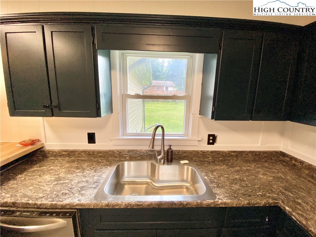 272 Clint Lewis Road Boone, NC 28607 - Photo 11 of 32 a bathroom with a sink and a mirror