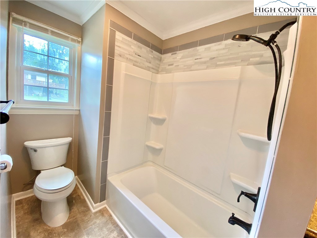 272 Clint Lewis Road Boone, NC 28607 - Photo 21 of 32 a bathroom with a toilet and a shower