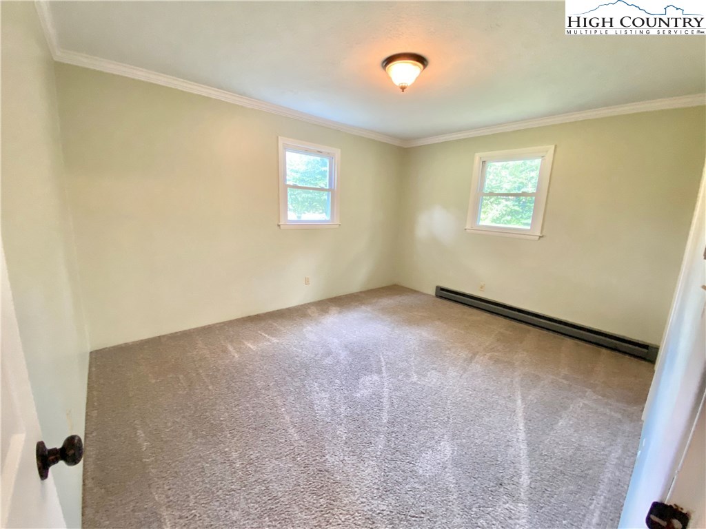 272 Clint Lewis Road Boone, NC 28607 - Photo 23 of 32 a view of an empty room with a window
