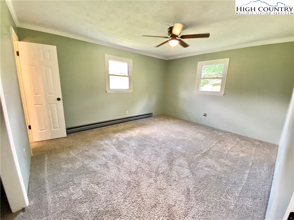 272 Clint Lewis Road Boone, NC 28607 - Photo 24 of 32 a view of an empty room with a window