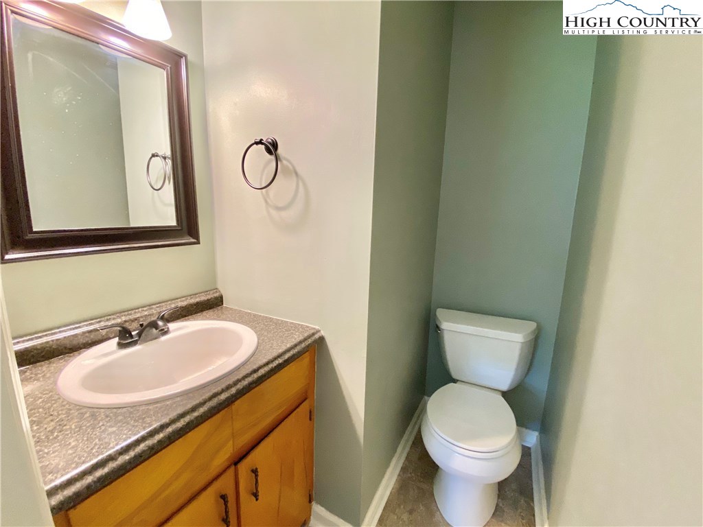 272 Clint Lewis Road Boone, NC 28607 - Photo 26 of 32 a bathroom with a sink toilet and mirror
