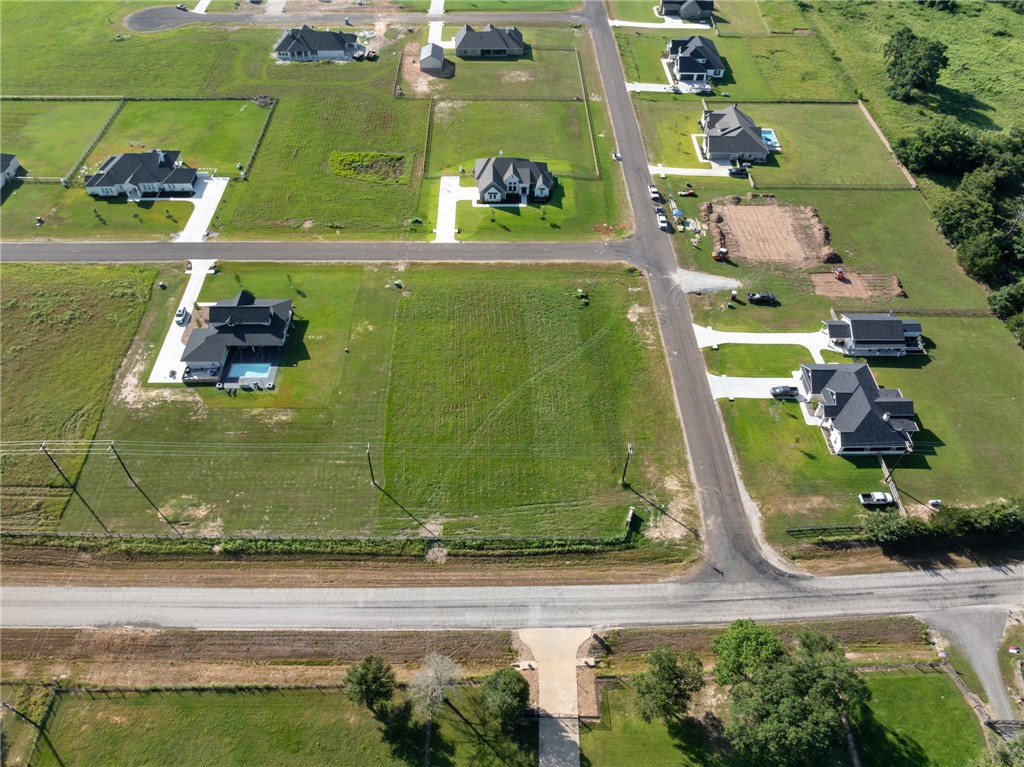 7801 Mathis Crk Drive Bryan, TX 77808 - Photo 4 of 12 an aerial view of a residential houses with outdoor space