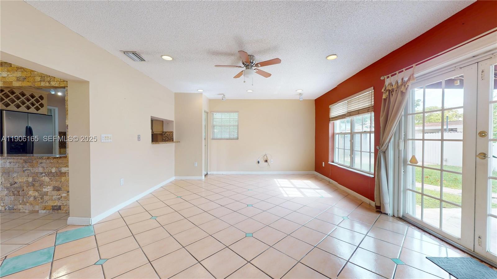 6051 Southwest 110th Avenue Miami, FL 33173 - Photo 14 of 49 a view of an empty room with window