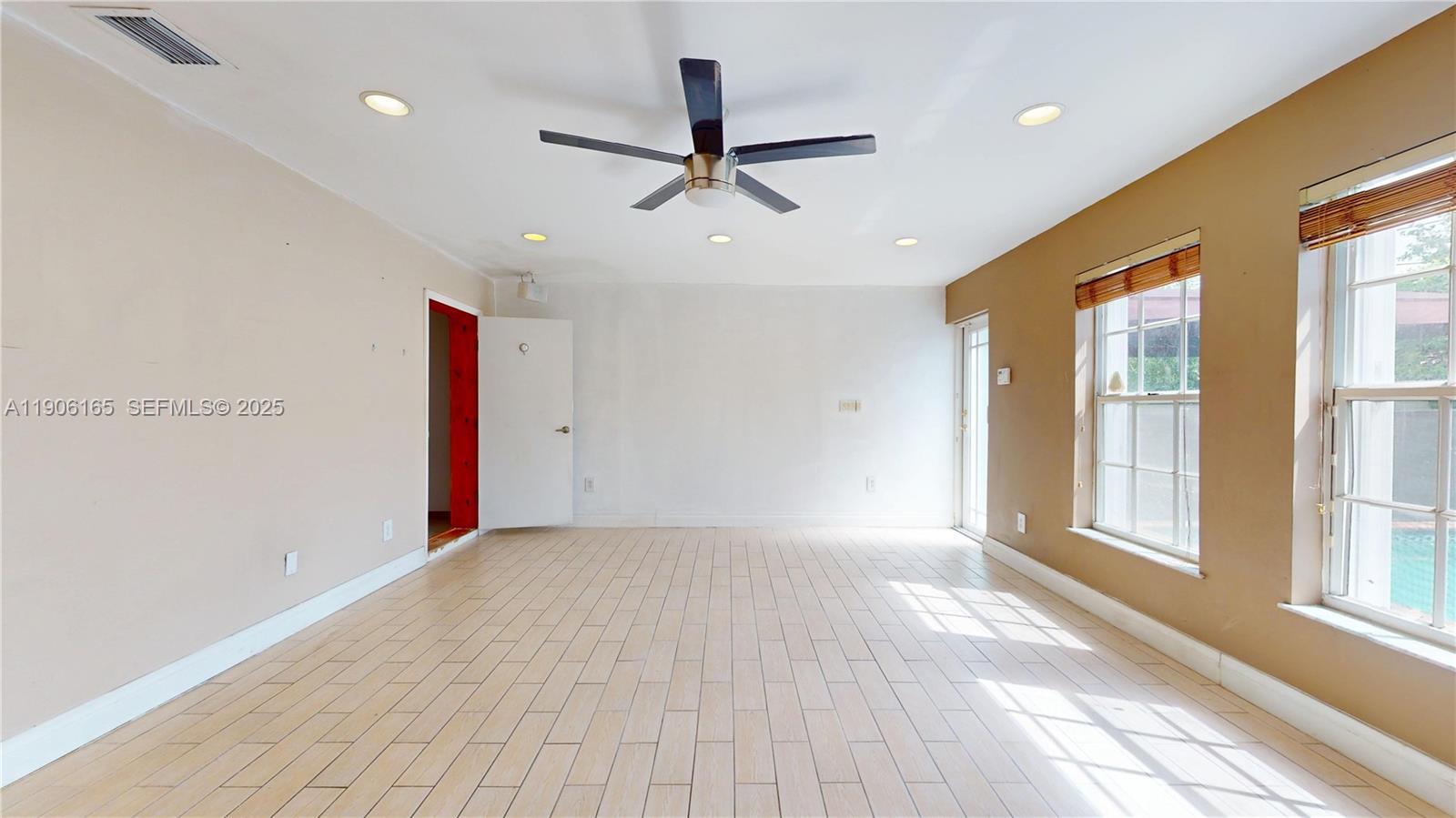 6051 Southwest 110th Avenue Miami, FL 33173 - Photo 21 of 49 a view of an empty room with a window