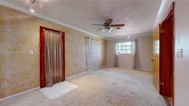 a room with a sink a washer and dryer