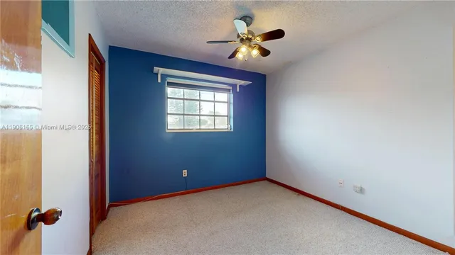 a view of a workspace with furniture