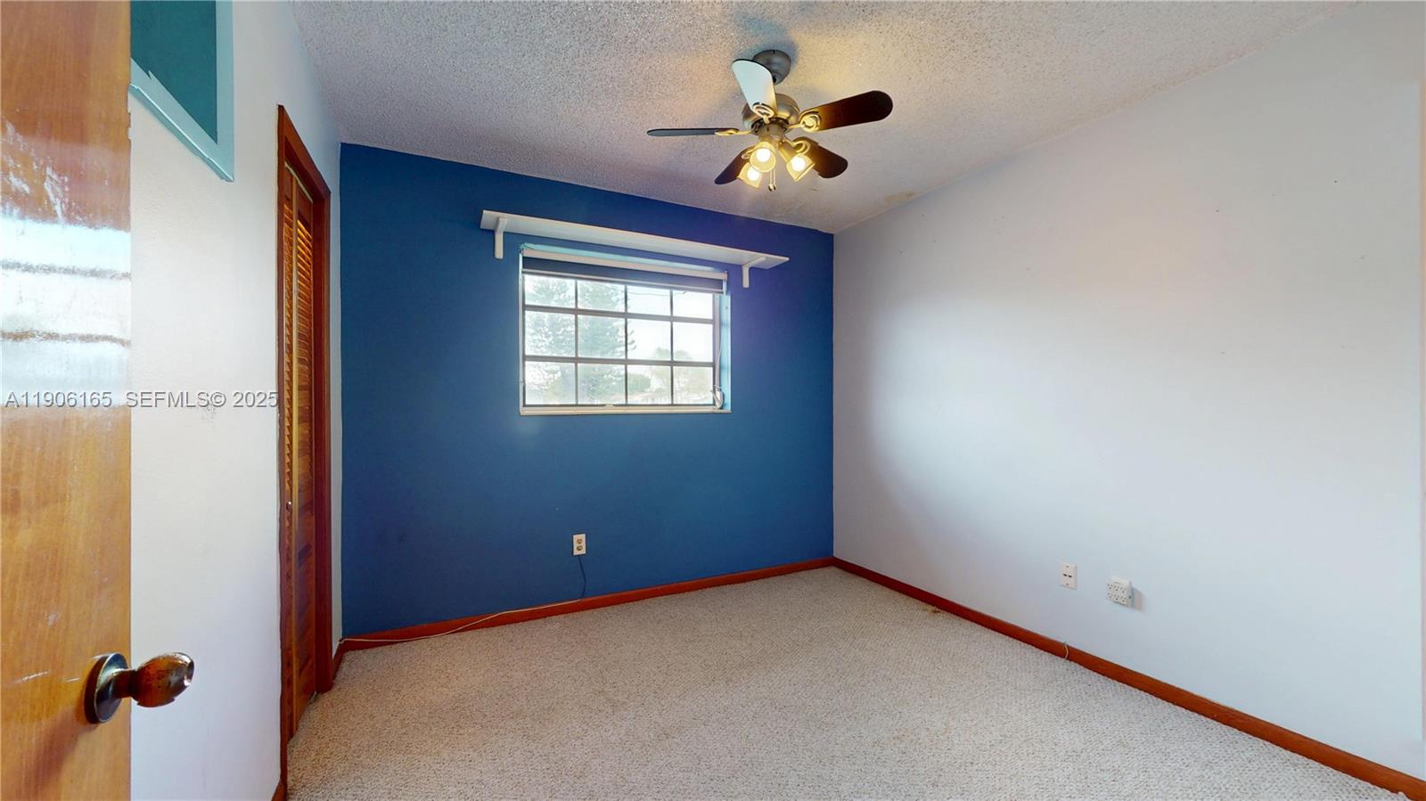 6051 Southwest 110th Avenue Miami, FL 33173 - Photo 30 of 49 a view of an empty room with a window