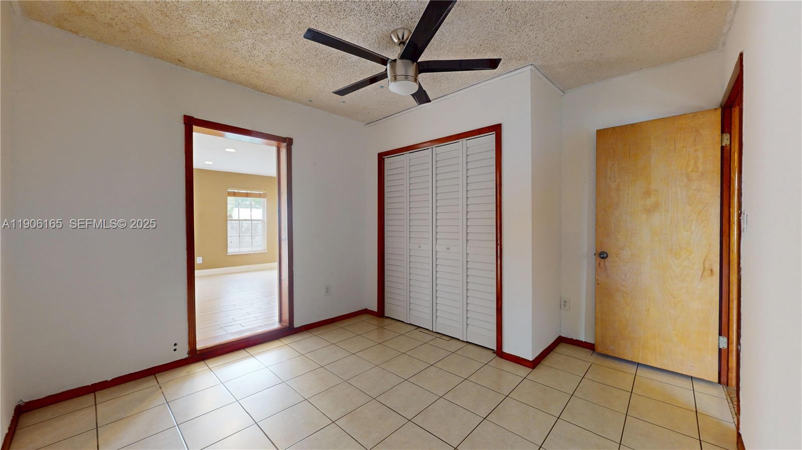 6051 Southwest 110th Avenue Miami, FL 33173 - Photo 34 of 49 a view of a livingroom with a chandelier fan and windows