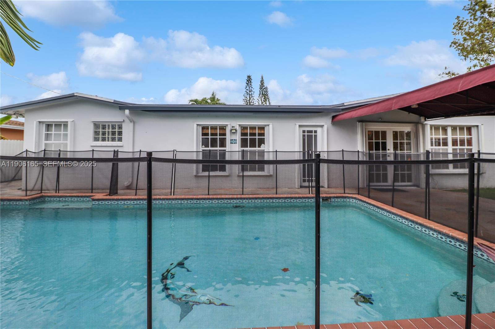 6051 Southwest 110th Avenue Miami, FL 33173 - Photo 41 of 49 a view of a house with a yard