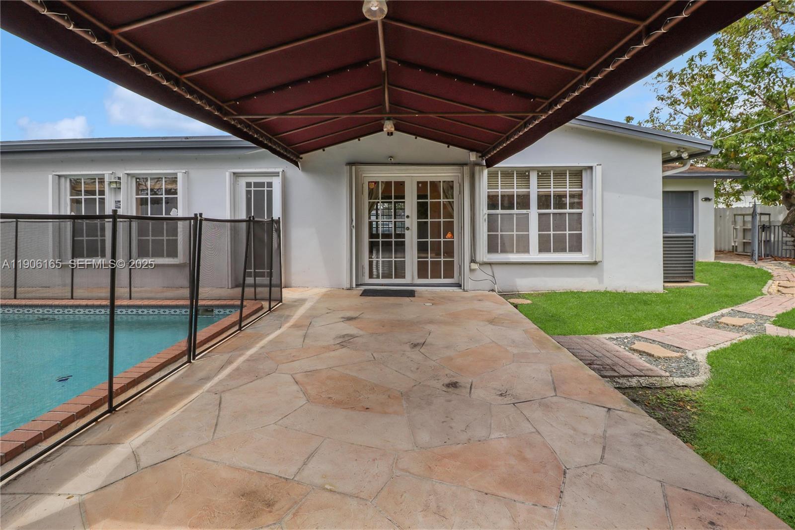 6051 Southwest 110th Avenue Miami, FL 33173 - Photo 42 of 49 a view of swimming pool with a backyard
