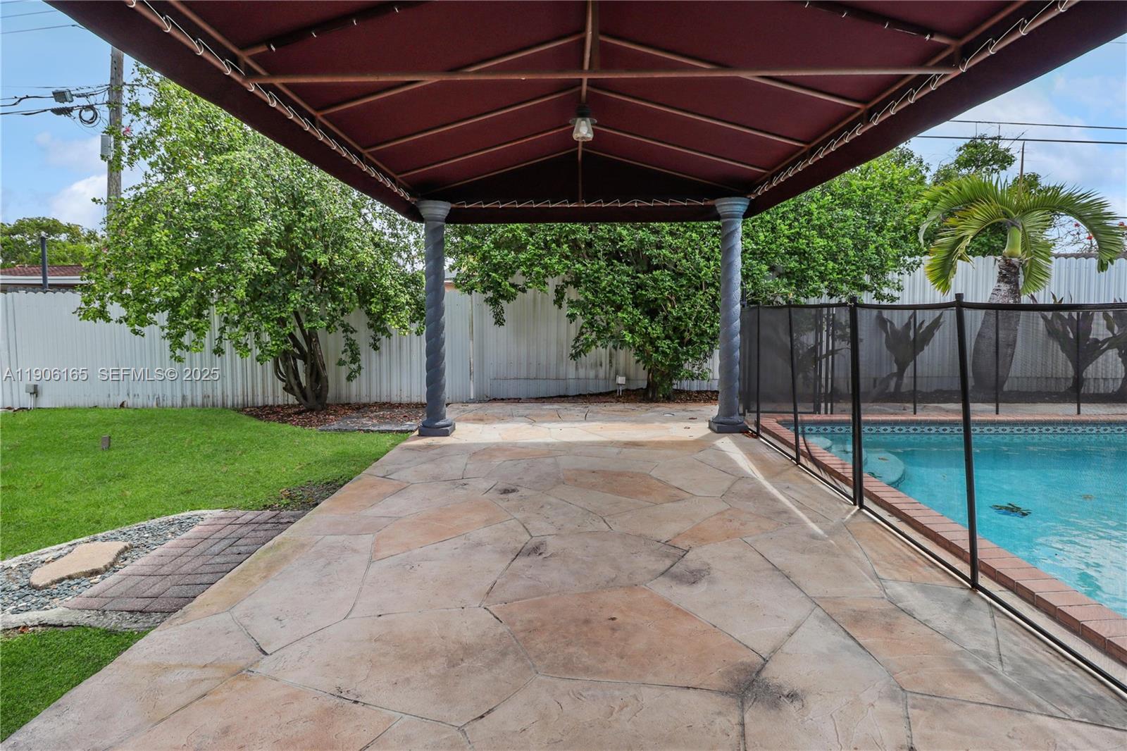 6051 Southwest 110th Avenue Miami, FL 33173 - Photo 43 of 49 a view of a backyard with wooden fence