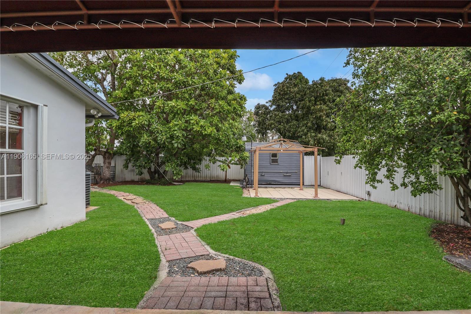 6051 Southwest 110th Avenue Miami, FL 33173 - Photo 45 of 49 a view of a backyard with large trees