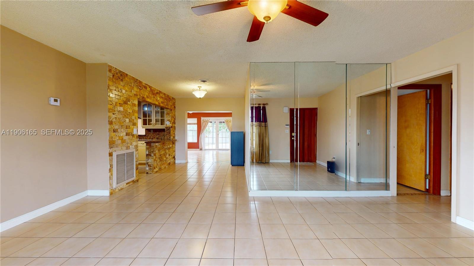 6051 Southwest 110th Avenue Miami, FL 33173 - Photo 8 of 49 a view of a hallway with wooden shelves