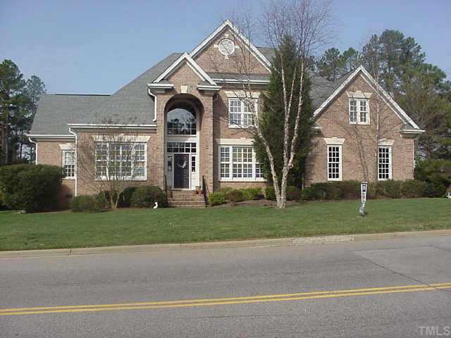 7409 Rainwater Road Raleigh, NC 27615 - Photo 1 of 1 a front view of a house with a yard and garage