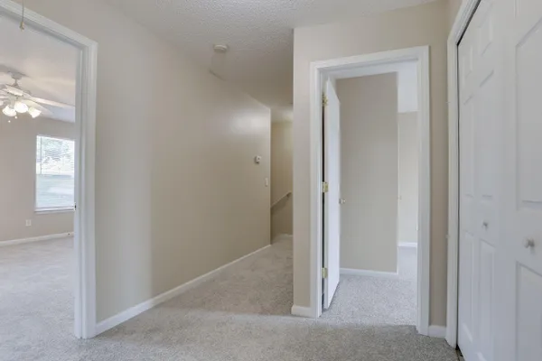 an empty room that has a mirror in it