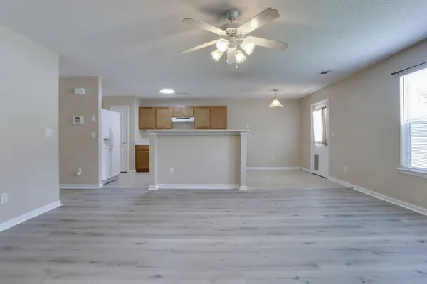 a view of a livingroom with a kitchen
