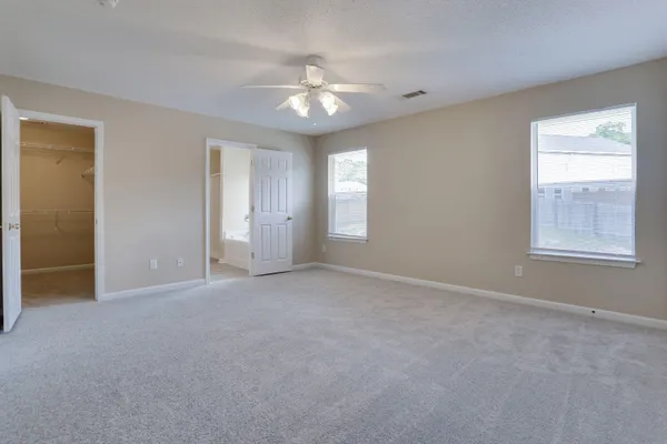 a view of an empty room with a window