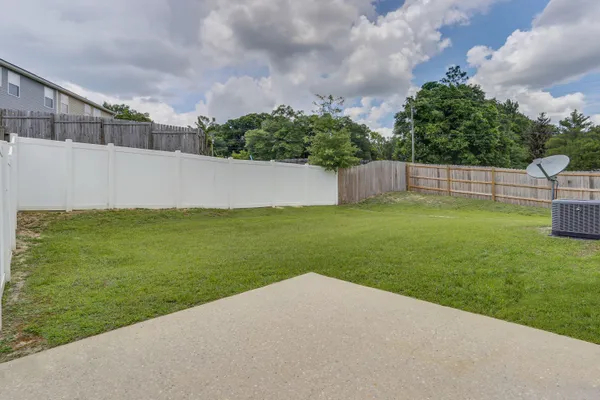 a view of a backyard with a small cabin