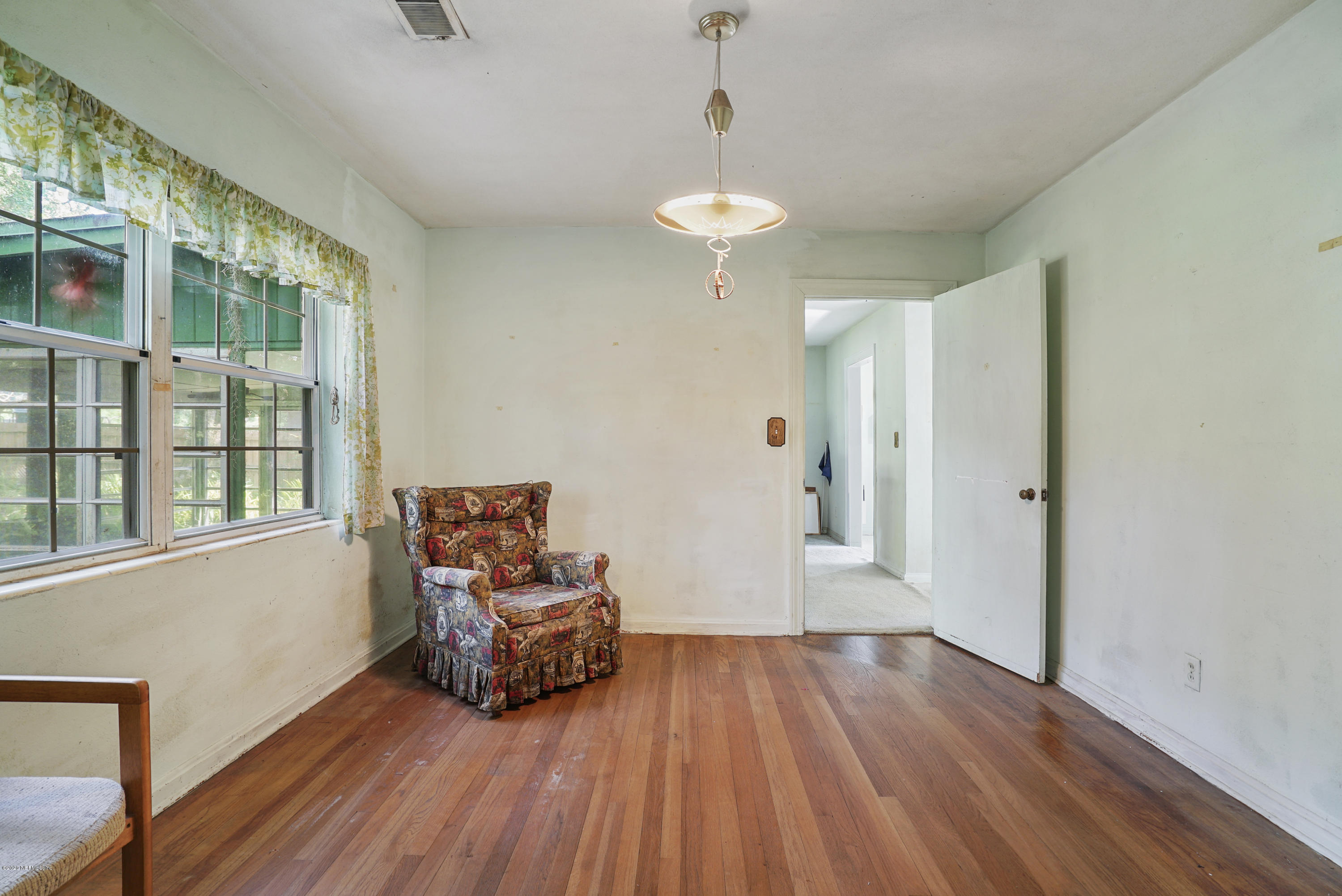 2531 Elbow Road Orange Park, FL 32073 - Photo 12 of 30 a room with furniture wooden floor and a chandelier