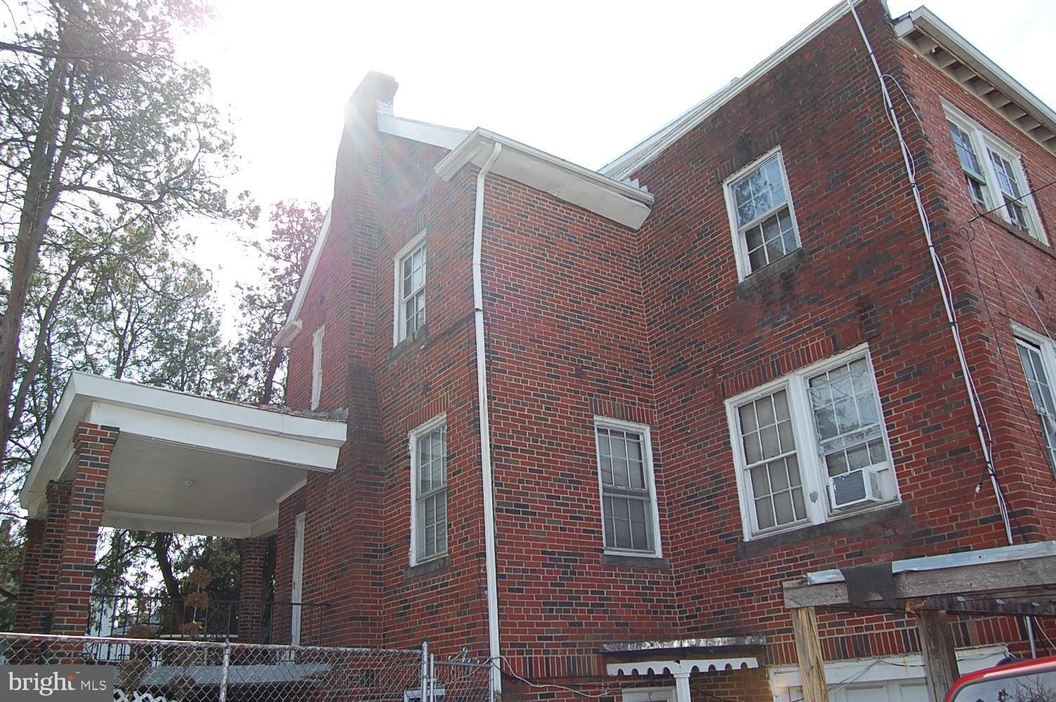 5328 Kansas Avenue Northwest Washington, DC 20011 - Photo 1 of 4 Side view with porch, basement entrance and garage