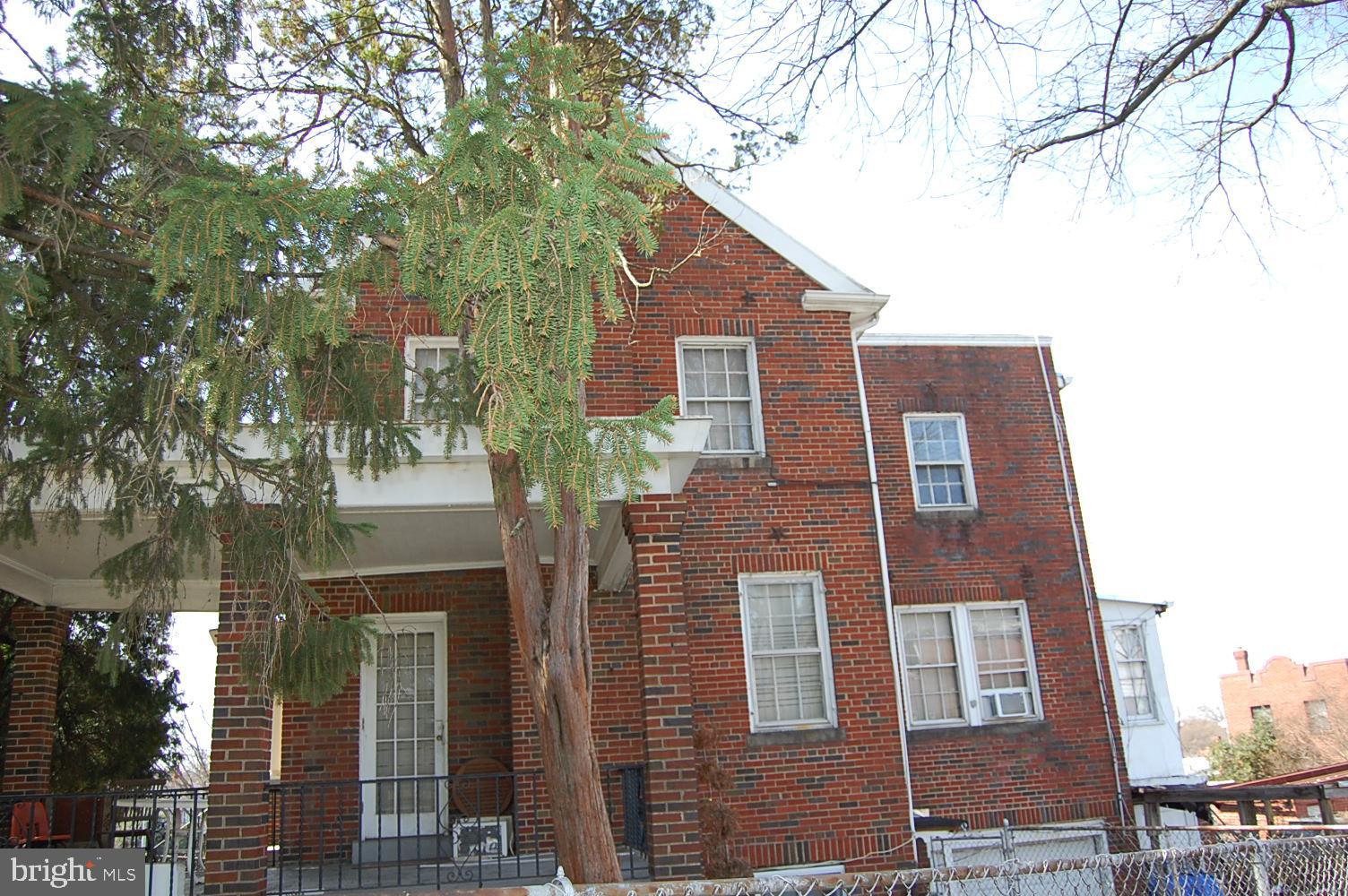 5328 Kansas Avenue Northwest Washington, DC 20011 - Photo 2 of 4 Side view, sunroom on back of house