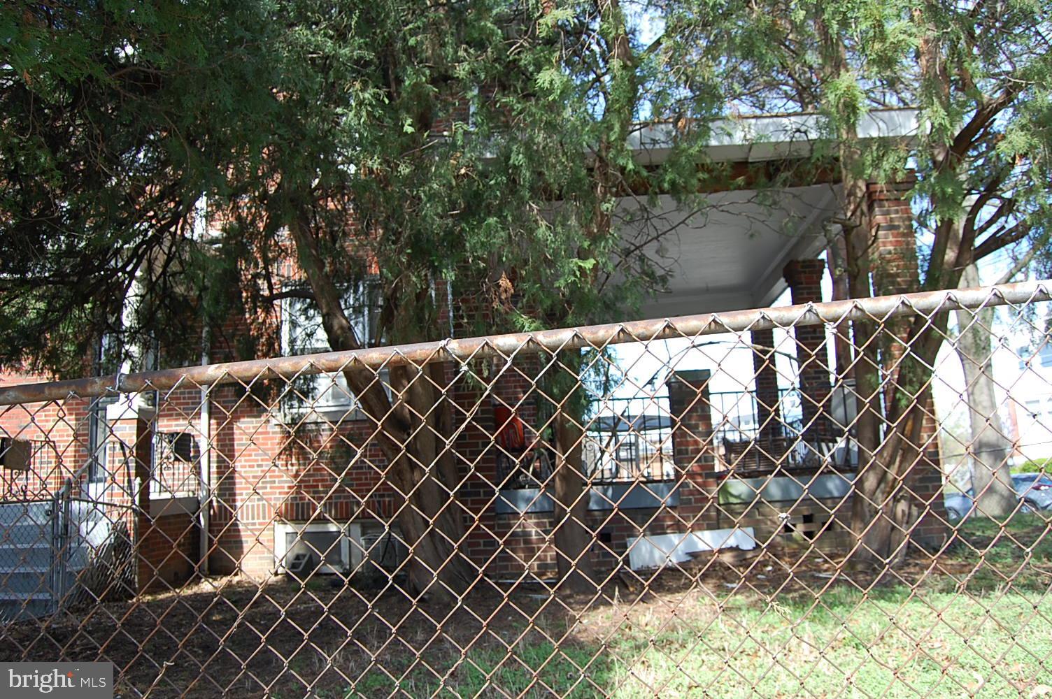 5328 Kansas Avenue Northwest Washington, DC 20011 - Photo 4 of 4 Fenced yard, side porch