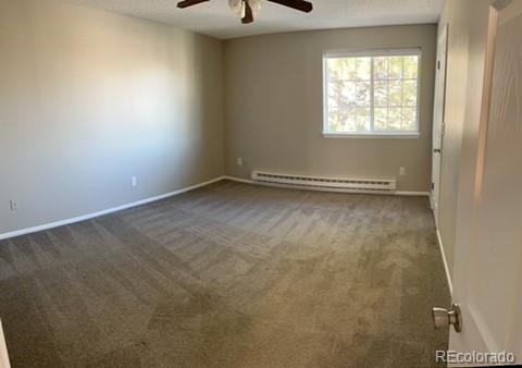 1976 Eagle Street Aurora, CO 80011 - Photo 5 of 14 an empty room with a window