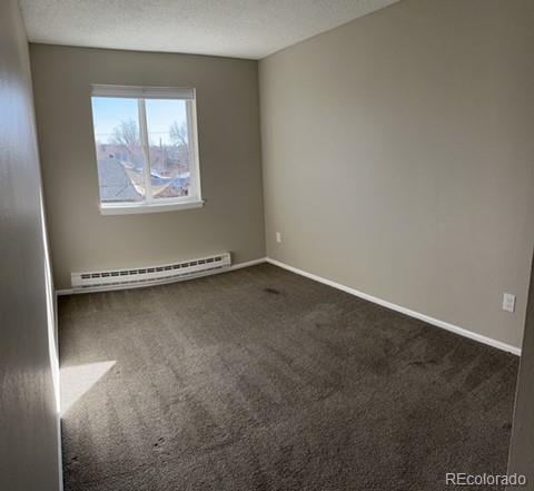 1976 Eagle Street Aurora, CO 80011 - Photo 7 of 14 an empty room with windows