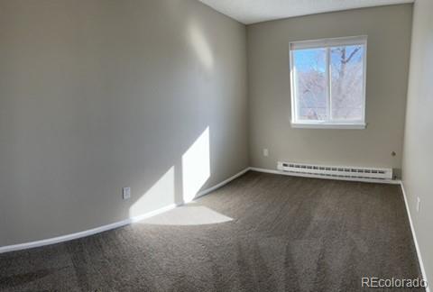 1976 Eagle Street Aurora, CO 80011 - Photo 8 of 14 a view of an empty room with a window