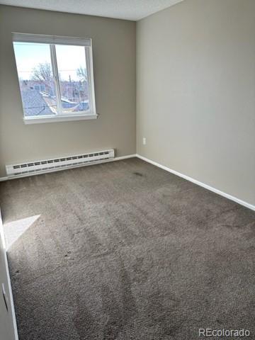 1976 Eagle Street Aurora, CO 80011 - Photo 10 of 14 an empty room with a window