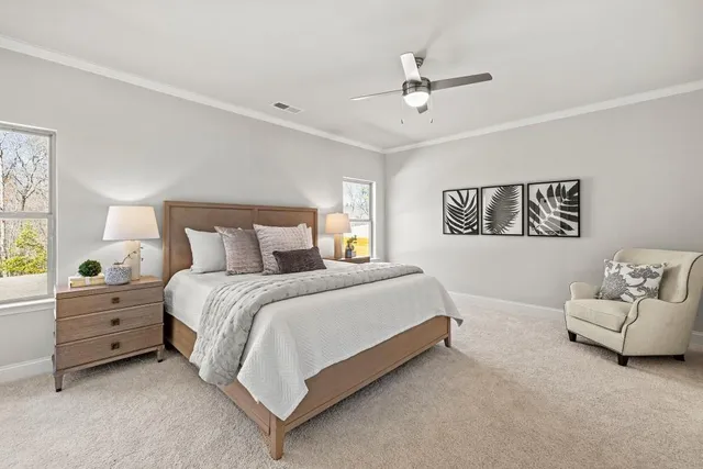 a bedroom with a bed and window